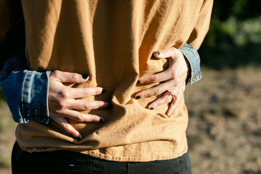 A Woman Hugs her Husband - Powered by Adobe