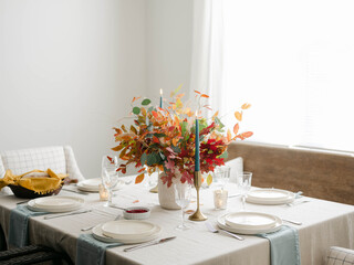 Fall decor table setting with foraged leaves