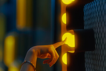 woman hand touch light