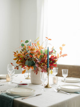 Fall decor table setting with foraged leaves