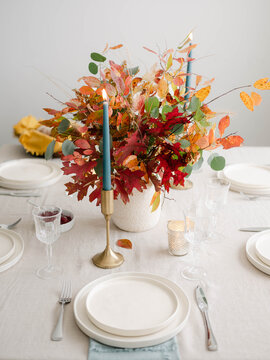 Fall decor table setting with foraged leaves