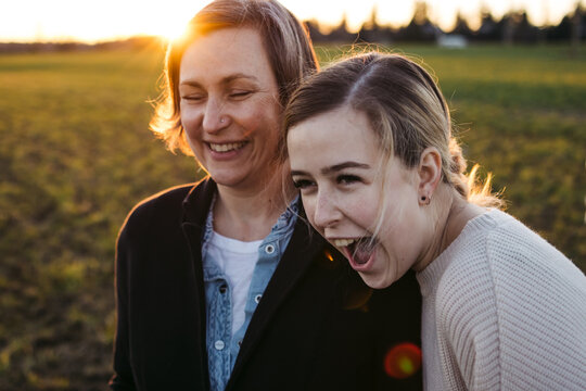 Mom and daughter outside together.