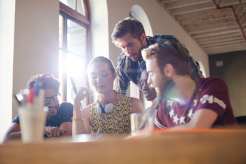 Creative business people brainstorming and working in office