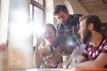 Creative business people brainstorming and working in office