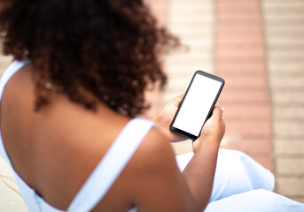 Woman using her Smartphone. Cell phone showing white screen.
