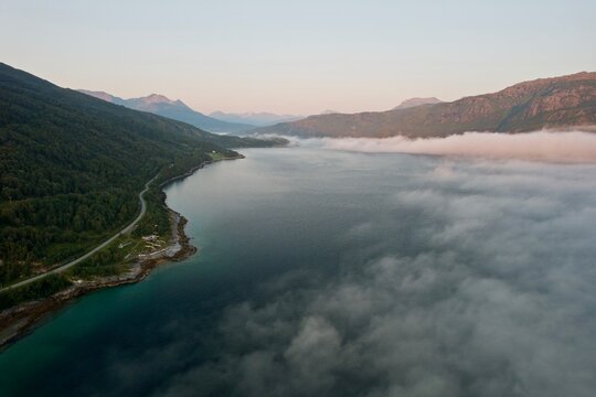 Misty clouds rolling over Norway fjord