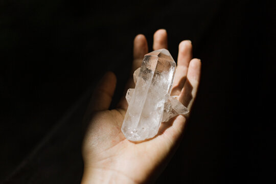 Hand holding a crystal