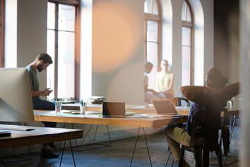 Casual business people working in open office