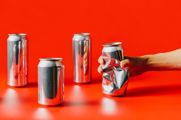 crumple an aluminum can with one hand