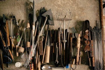 Top view of different tools of glassblowing on tabletool,