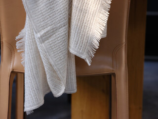 Soft plaid on leather chair