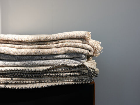 Stacked plaids on shelf