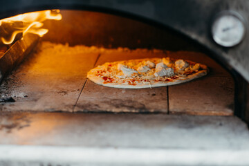 Pizza oven with pizza margherita
