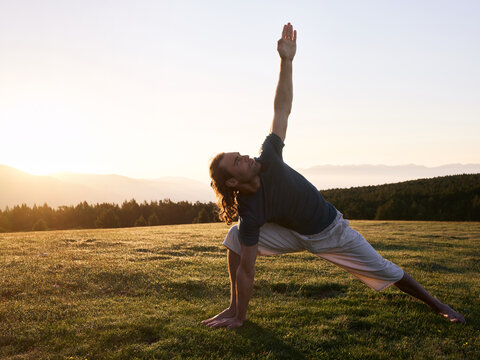 Man in extended triangle pose.