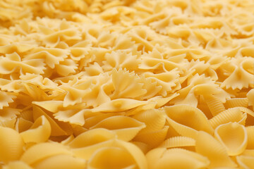 Heap of uncooked pasta as background