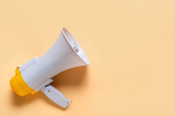 Modern megaphone on color background