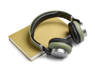 Modern headphones with book on white background