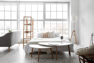 Interior of stylish room with comfortable bed