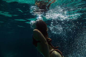 Woman swimming underwater