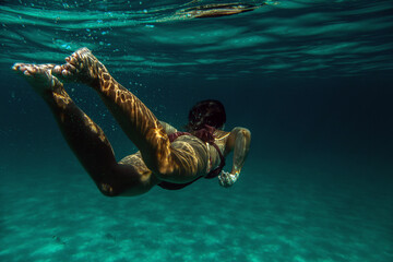 Woman swimming underwater