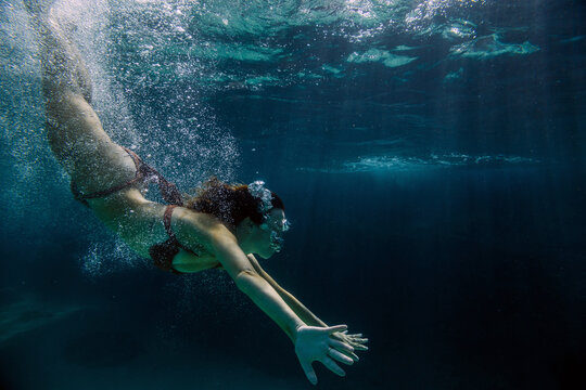 Woman swimming underwater