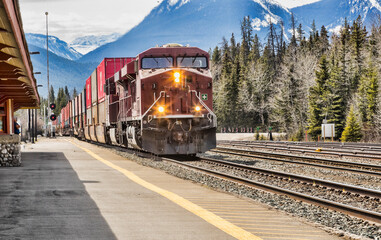 A freight train passing through the mountains. Taken in Alberta, Canada