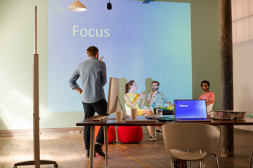 Business people preparing audio visual presentation on Focus