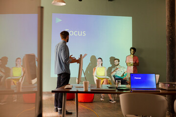 Business people preparing audio visual presentation on Focus