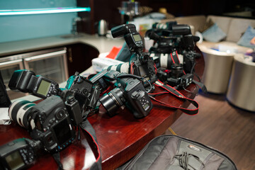 Close up of cameras laying on table