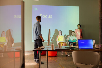 Business people preparing audio visual presentation on Focus