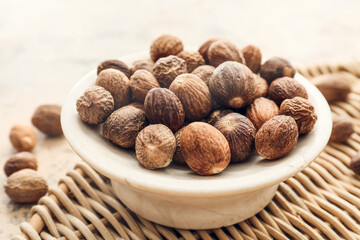 Bowl with shea nuts on table, closeup