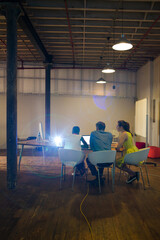 Lens flare over creative business people working in office