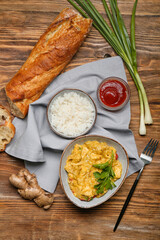 Composition with tasty chicken curry on wooden background