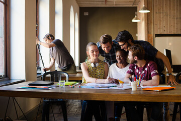Creative business people brainstorming and working in office