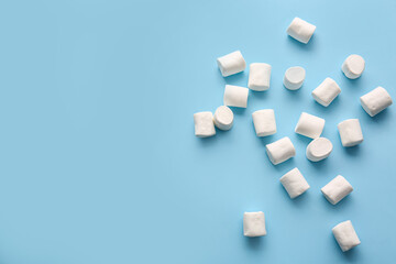Tasty marshmallows on color background