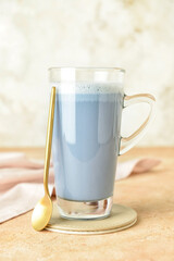 Glass cup of tasty Charcoal Latte on table