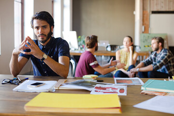 Portrait confident casual businessman in sunny office