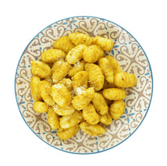 Plate with tasty pesto gnocchi on white background