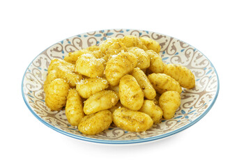 Plate with tasty pesto gnocchi on white background