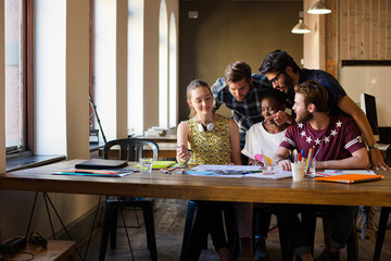 Creative business people brainstorming and working in office