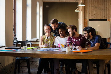 Creative business people brainstorming and working in office