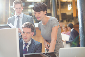 Business people working at computer in office