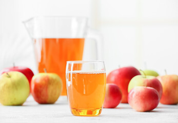 Glass of apple juice on table