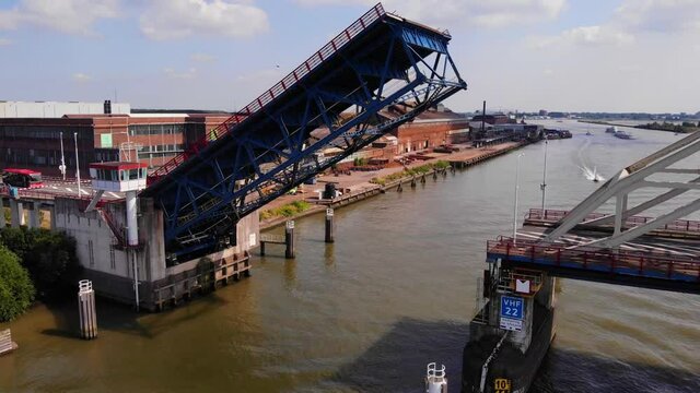 Drone Towards Opened Bascule Bridge Over Noord River In Alblasserdam Near Hendrik ido ambacht, South Holland, Netherlands. - Aerial