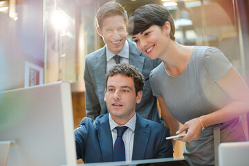 Business people working at computer in office