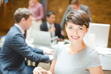 Smiling businesswoman posing in office