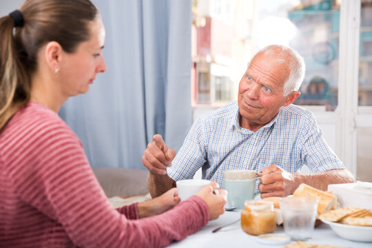 Elderly father threatens finger of her adult daughter. High quality photo
