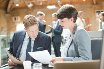 Business people working at laptop