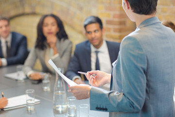 Businesswoman leading meeting in conference room