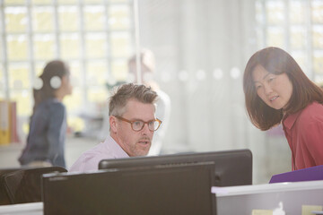 Business people working at computer in office